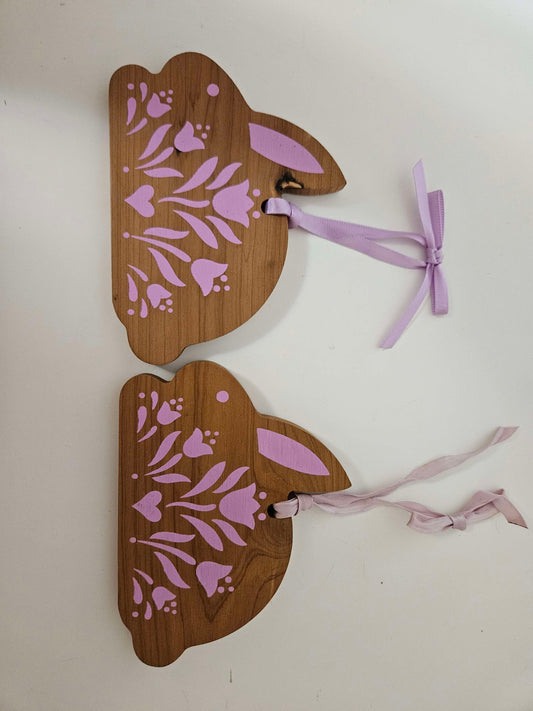 2 Wooden Bunny's With Pink Ascents