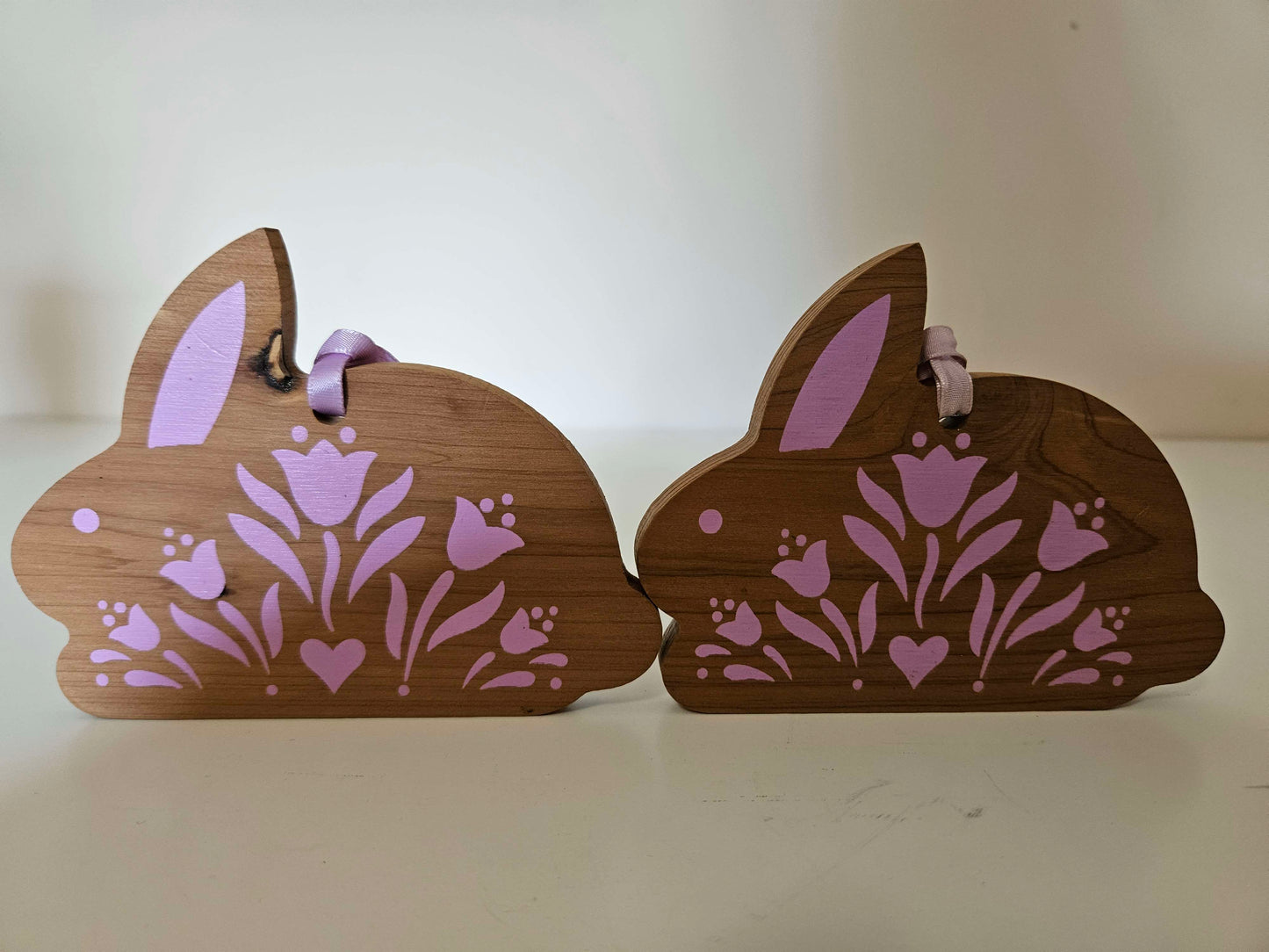 2 Wooden Bunny's With Pink Ascents