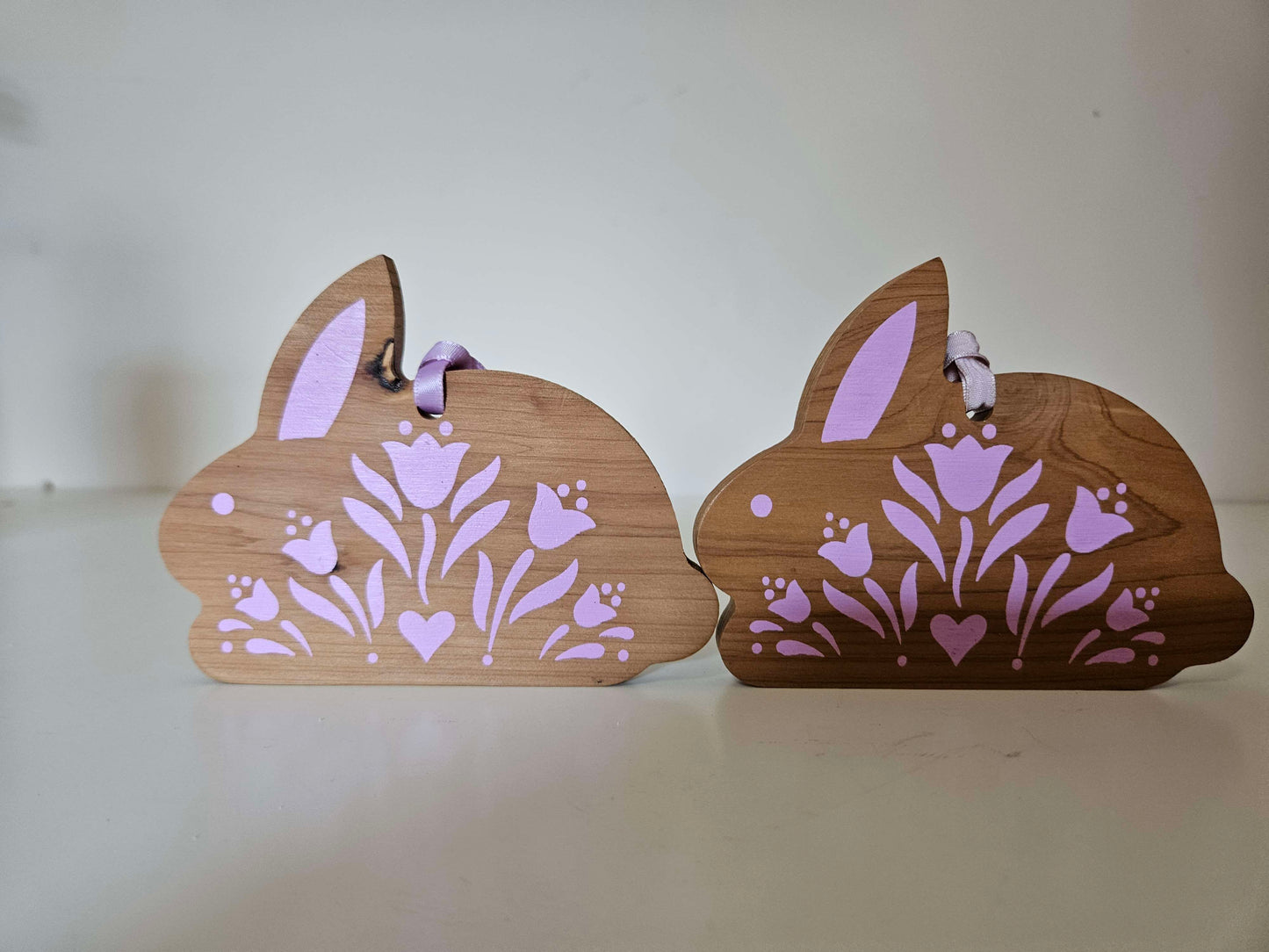 2 Wooden Bunny's With Pink Ascents
